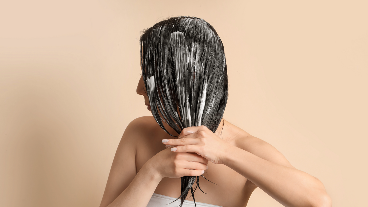 Woman balming her hair