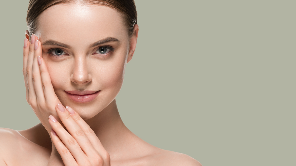 Woman feeling her face