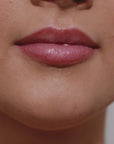 Girl applying espresso martin colour lip gloss